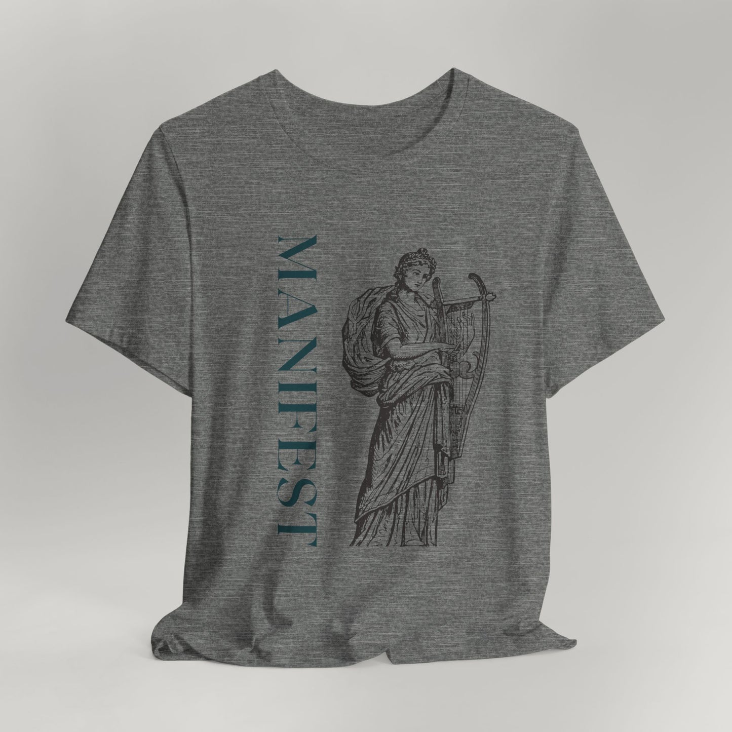 Gray t-shirt with a graphic design and the word 'MANIFEST' on a light gray background
