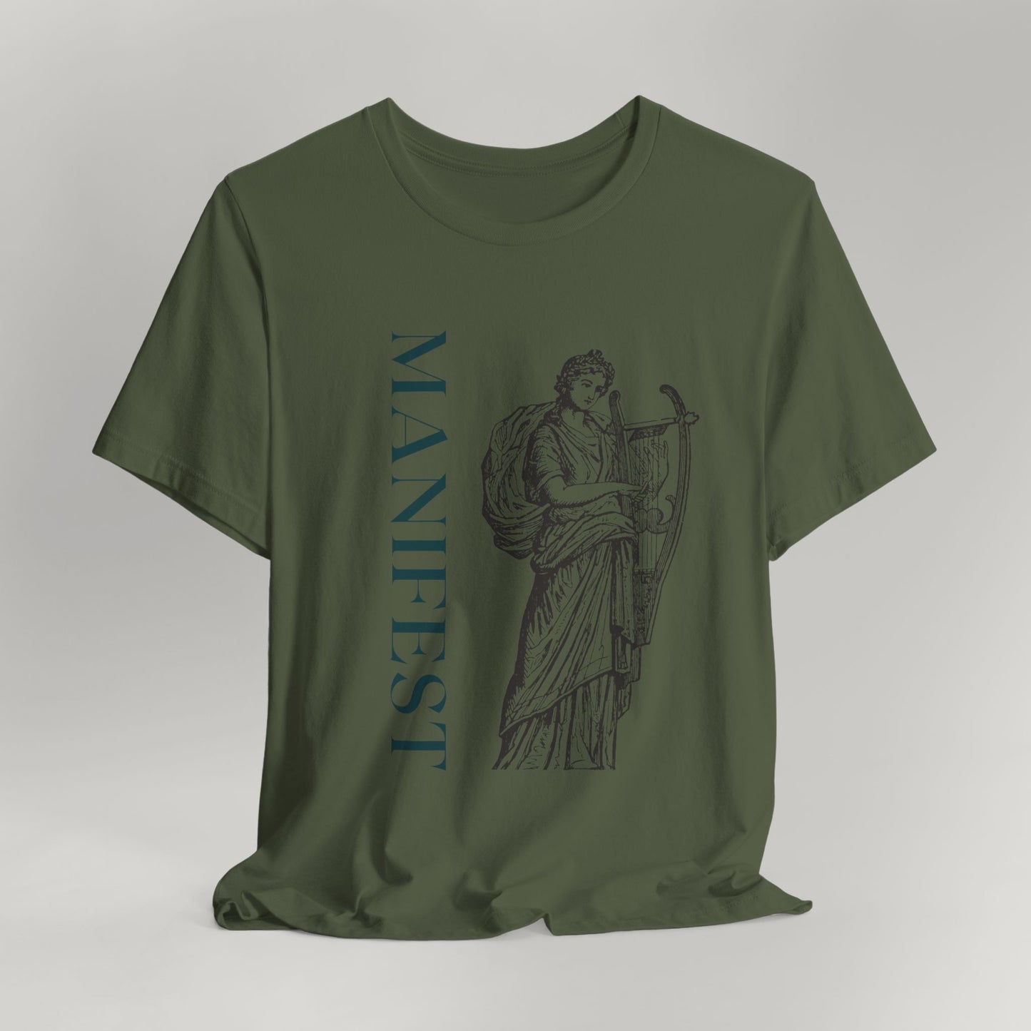 Green t-shirt with classical statue and 'MANIFEST' text on a gray background